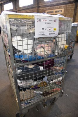 a cart with many items in it in a warehouse