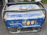 a small blue generator sitting on the ground next to a motor scooter