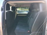 the back seat of a car with the door open and the passenger seat down