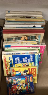 a lot of books on a shelf next to a book case