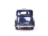 a blue toy car that is sitting on a white surface