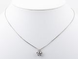 a white necklace with a flower pendant on a white mannequin