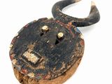 an old wooden padlock with horns on a white background