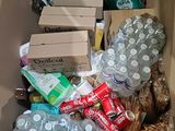 a cardboard box filled with lots of food and drinks