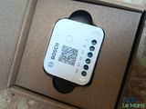 a smart device in a box with a qr code on it