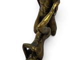 bronze statue of a man holding a woman on his back