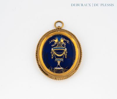une image représentant un médaillon bleu et or sur un fond blanc