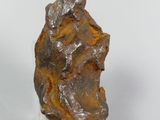 an image of a piece of rock on a glass stand
