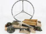 a steering wheel and other items on a table