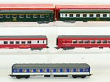 four train cars that are on display in a display case