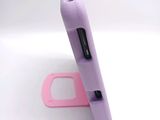 a cell phone that is sitting on top of a stand