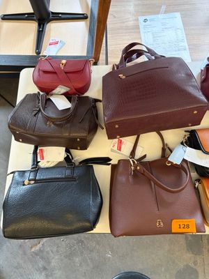 a lot of purses that are on a table