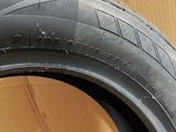 a close up of a tire on a wooden surface