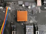a close up of a computer motherboard with wires attached to it