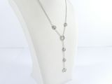 necklace on a mannequin head with a chain of silver beads
