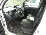 the interior of a small white car with black seats and a steering wheel