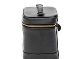 the small black bag is sitting on a white surface