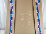 a picture of a picture frame made out of a cardboard box