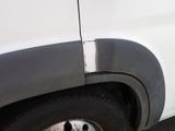 a white van with a hole in the side of it