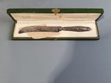 a knife in a box on a table