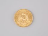 an image of a gold coin on a white surface