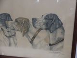 painting of three dogs with collars in a frame on a wall