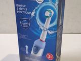 a box with a toothbrush in it on a table
