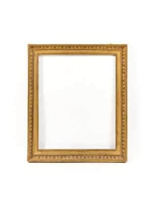 a gold frame on a white wall with a white background