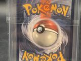 a close up of a pokemon card in a clear box