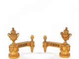 pair of gold plated candlesticks with a cup and saucer