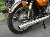 a motorcycle that is parked on the street in front of a building