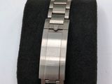 a watch that is sitting on top of a black cloth