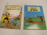 two children ' s books are sitting on a white table