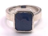 an image of a ring with a blue stone in it