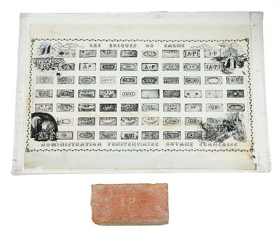 a close up of a brick and a piece of paper on a table