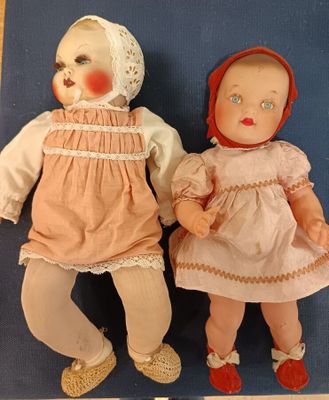 2 Poupons tête celluloïde bouche ouverte sur dents, yeux fix…