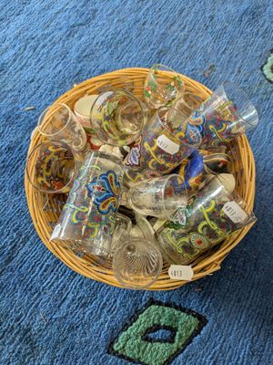 a basket full of empty bottles sitting on the floor
