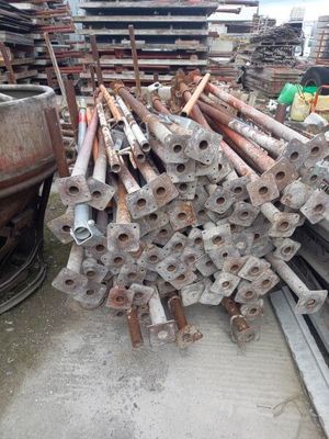 a large pile of pipes and pipes in a warehouse