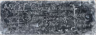 a chalk board with writing on it on the wall