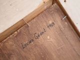 a close up of a piece of wood with writing on it