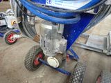 a blue machine that is sitting on the ground