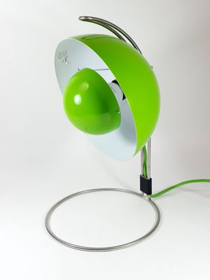 lime green table lamp with a white base and a black cord