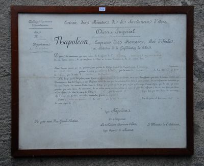 a plaque on the side of a building that has a document on it