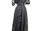 a black dress with a lace overlay and a bow on the waist