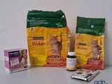 two bags of cat food and two packages of cat food