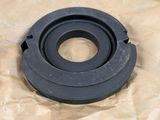 a close up of two black rubber parts on a piece of paper