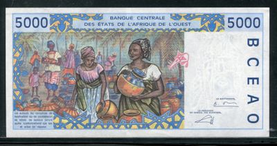 un gros plan d'un billet de banque sur lequel figure l'image d'une femme tenant un bébé dans ses bras