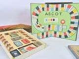two books and a board game on a table