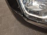 a close up of a car ' s headlight on the ground