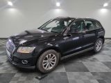 an image of a black audi suv parked in a garage